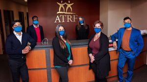 ATRF employees standing at front desk